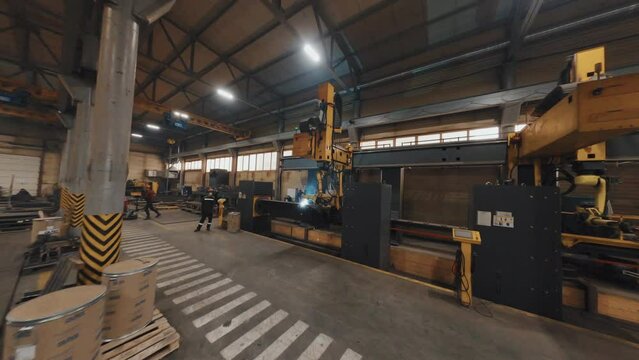 Drone footage of robotic welding equipment at manufacture