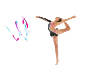 Foto op Plexiglas anti-reflex Portrait of young sportive girl, rhythmic gymnastics artist isolated on white studio background. Concept of sport, action, aspiration, education, active lifestyle © master1305