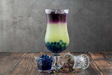 Fruity Bubble Tea in glass cup on dark background