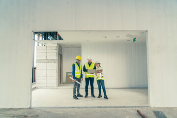 Asian people team Engineer working building inspection use augmented reality technology in tablet...