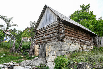 Fototapeta na wymiar An old and abandoned barn in the village. Stone barn. 