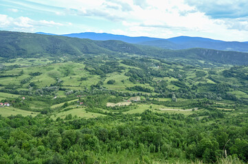 Fototapeta na wymiar Green hills in spring. Nature in Bosnia and Herzegovina. 