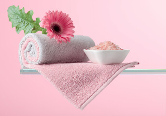 Fototapeta Spa composition with pink salt, Gerber, and towels. obraz