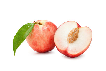 whole and half of nectarine fruit  with green leaf isolated on white.