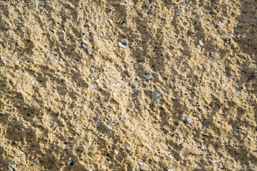 Sandstone texture. Yellow stone background
