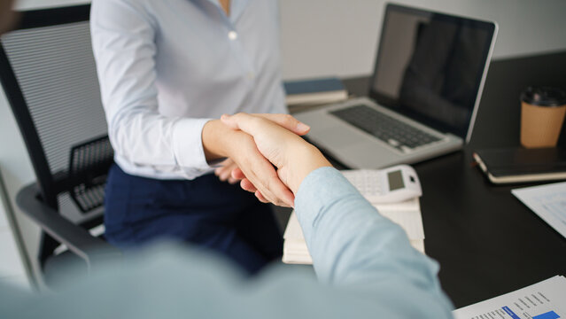 Business concept, Business colleagues shaking hands together after working successfully