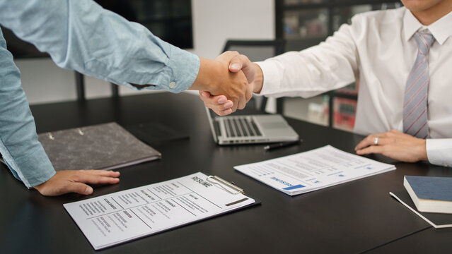 Recruitment concept, Male employer shaking hands with applicant to congratulation for new job