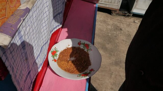 close up Grinding peanut sauce for Indonesian traditional food, Ketoprak, manually called ulekan