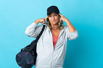 Middle aged sport woman over isolated background having doubts and thinking