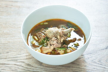 hot and spicy duck meat with tamarind and Thai herbs soup on bowl 