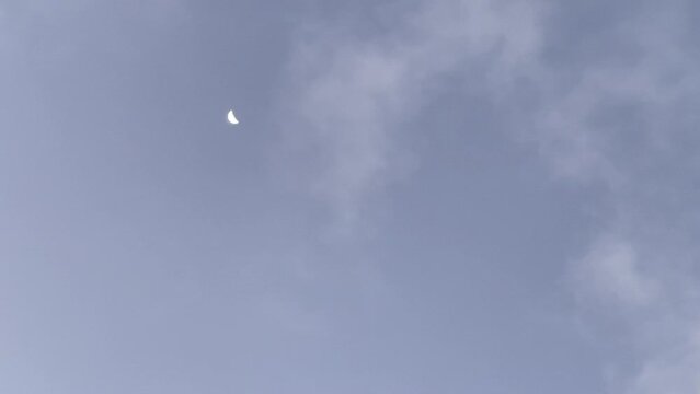 The moon on the cloudy sky in the morning