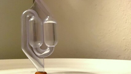 Beer brewing airlock in progress close up view