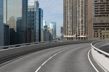 Empty urban asphalt road exterior with city buildings background. New modern highway concrete construction. Concept of way to success. Transportation logistic industry fast delivery. Chicago. USA.