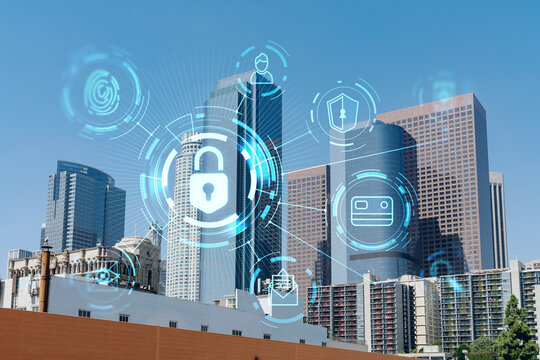 Panorama cityscape of Los Angeles downtown at day time, California, USA. Skyscrapers of LA city. Glowing Padlock hologram. The concept of cyber security to protect companies confidential information