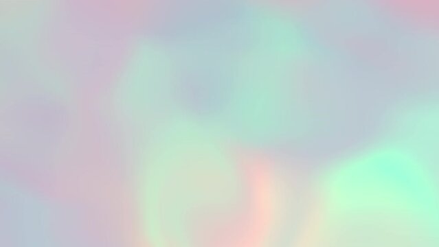 Looped animated abstract background of a blurred iridescent texture with colored light reflections