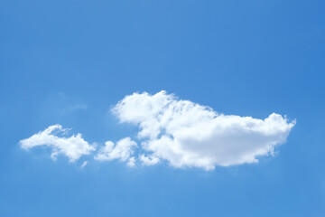 Fototapeta premium Single white cloud on blue sky background