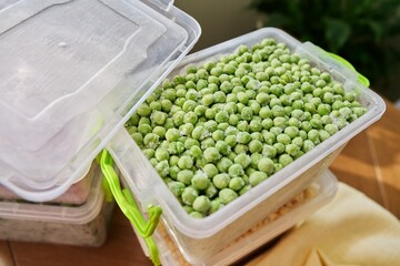 Frozen vegetables and fruits, close-up frozen green peas