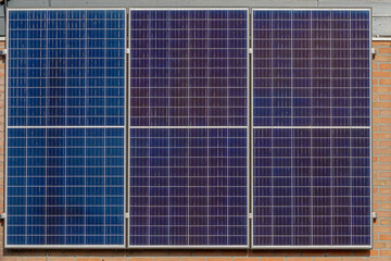 Solar cell panels on the brick wall, Photovoltaic cell is an electrical device that converts the...