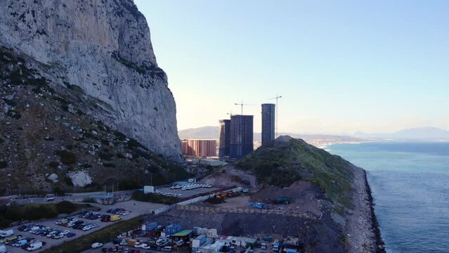 Parking Area By The Sheer East Side Of The Rock Of Gibraltar. drone ascend, tilt-up