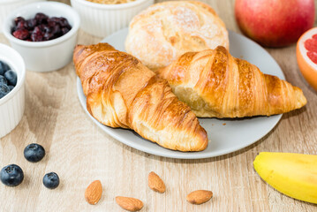 Healthy breakfast. Croissants, buns, cottage cheese, berries and fruits and berries