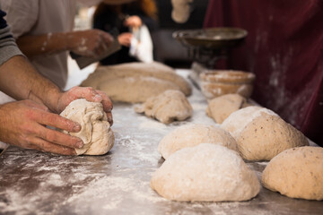 male hands knead yeast dough for baking bread