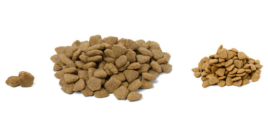 triangular pieces of animal food on a white background. Pile of nutritious food
