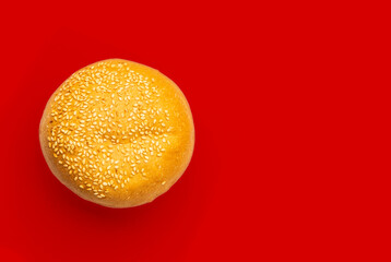 Homemade freshly baked burger bun on isolated background. Top view