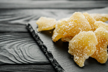 spicy dried ginger on a black wooden rustic background
