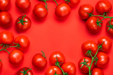 Tomato on a branch sprout on white wooden table top view flatlay. Fresh juicy ripe tomato Red Cherry fruits. Salad preparation ingredients. Empty copy space for mockup