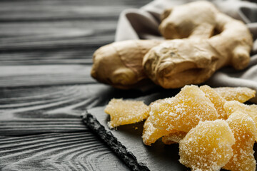 spicy dried ginger on a black wooden rustic background