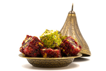Turkish delight isolated on a white background. Traditional Turkish delicacies. Varieties of Turkish Delight with Pistachio. close up
