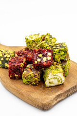Turkish delight isolated on a white background. Traditional Turkish delicacies. Varieties of Turkish Delight with Pistachio. close up