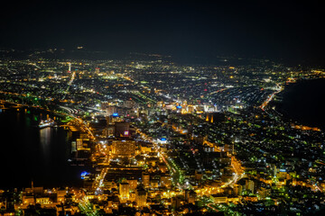 Obraz premium Hakodate,Hokkaido,Japan on April 28,2018: Night views of Hakodate city from Mount Hakodate.One of Japan's three best night views.