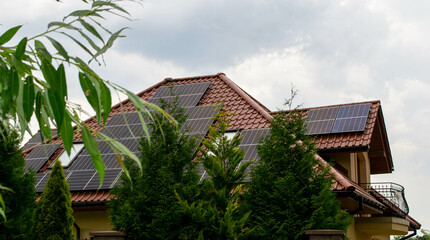 Fototapeta na wymiar Historic farm house with modern solar panels on roof and wall High quality photo