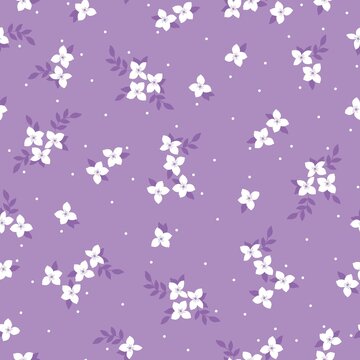 Simple vintage pattern. Small white flowers and dots on a lilac background. Fashionable print for textiles and wallpaper.