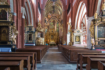 Fototapeta na wymiar Torun, Poland, May 09, 2022: The interior of the Church of St. James in Torun.