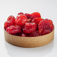 dried dogwood berry on a white acrylic background