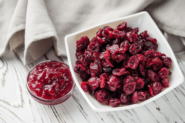 dried cranberry berry on a white wooden rustic background