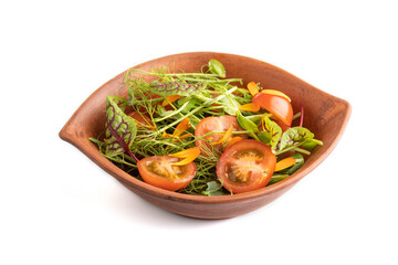 Vegetarian salad of tomatoes, marigold, microgreen isolated on white. Side view, close up.