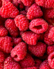 Close up fresh raspberries on the table