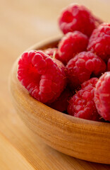 Close up fresh raspberries on the table