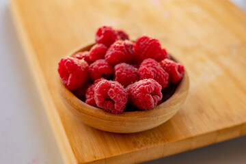 Close up fresh raspberries on the table