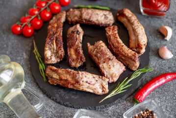 grilled pork ribs on a stone background