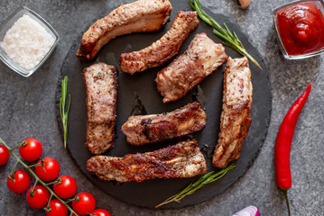 grilled pork ribs on a stone background