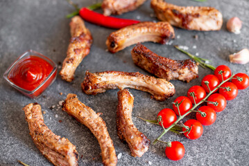 grilled pork ribs on a stone background