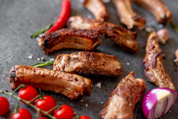 grilled pork ribs on a stone background
