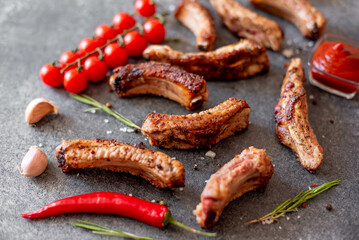 grilled pork ribs on a stone background