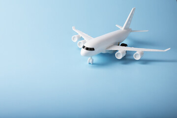 airplane toy on a blue background,copy space