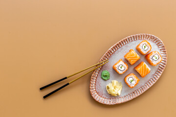 Japanese cuisine. Sushi roll set with salmon on dish