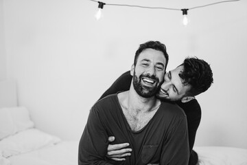 Happy gay men couple having tender moment in the morning at home